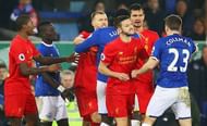 LIVERPOOL, ENGLAND - DECEMBER 19:  Adam Lallana of Liverpool (3R) and Seamus Coleman of Everton (23) confront each other as players clash during the Premier League match between Everton and Liverpool at Goodison Park on December 19, 2016 in Liverpool, England.  (Photo by Clive Brunskill/Getty Images)